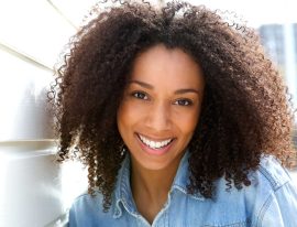 cheerful-young-african-american-woman-PZQTU5RRE.jpg