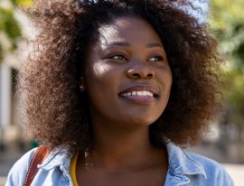 happy-black-woman-thinking-CES3A2U.jpg